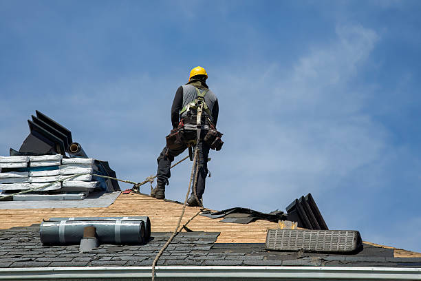 Professional Roofing technician working in Hollis, NY